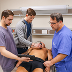 KCU students practicing POCUS with Dr. Arnce 